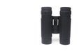 Closeup small binocular two eyepieces white background Royalty Free Stock Photo