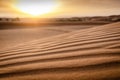 Close up of a small sand dune in the desert with sunrise. Blurry background. Dunes of Erg Chebbi in Morocco with sunset. Texture Royalty Free Stock Photo