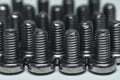 Close Up of Small Screws in Rows Royalty Free Stock Photo