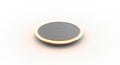 Close up of a small silver button cell battery with a warm glow around its edge Royalty Free Stock Photo