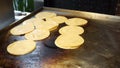 Close-up of small soft tortillas on a griddle