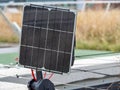 Close up of small solar panel on the green roof Royalty Free Stock Photo