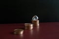 Row of 3 small stacks of money euro coins and a crystal gemstone Royalty Free Stock Photo