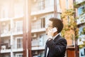 Close-up smart Business man wearing modern black suit and white shirt and calling on mobile smart phone. Royalty Free Stock Photo