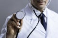 Close up of smart doctor holding stethoscope Royalty Free Stock Photo
