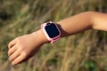 Close up smart watch on child& x27;s arm Royalty Free Stock Photo