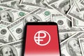 Close up of smartphone with digital ruble logo on screen. Phone with red digital ruble logo on background of dollars. Royalty Free Stock Photo