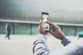 Close-up of smartphone with graphs, diagrams and charts on screen in male hands. Royalty Free Stock Photo