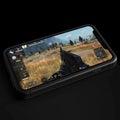 Smartphone Display Showing an Intense Gaming Experience with Futuristic Interface Elements Royalty Free Stock Photo