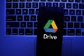 A close-up of a smartphone screen displaying the official Google Drive logo and cloud storage interface Royalty Free Stock Photo