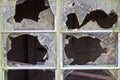 Close up of smashed panes of glass in a window Royalty Free Stock Photo