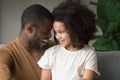 Close up African American father and preschool daughter touching forehead Royalty Free Stock Photo