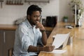 Close up smiling African American man reading good news