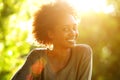 Close up smiling african american woman with sunset Royalty Free Stock Photo