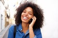Close up smiling african american woman talking on smart phone Royalty Free Stock Photo