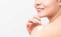 Close up of smiling Asian woman hand holding and applying moisturiser on shoulder, Body lotion,  on white background. Royalty Free Stock Photo