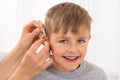 Close-up Of A Smiling Boy With Hearing Aid Royalty Free Stock Photo