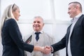 close up. smiling business people shaking hands. Royalty Free Stock Photo