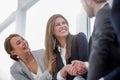 Close up.smiling business woman shaking hands with partners Royalty Free Stock Photo