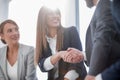 Close up.smiling business woman shaking hands with partners Royalty Free Stock Photo