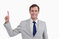 Close up of smiling businessman pointing up Royalty Free Stock Photo