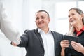 Close up. smiling businessman shaking hands with his business partner Royalty Free Stock Photo