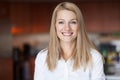 Close up Of A Smiling Caucasien blond woman in the kitchen at the office Royalty Free Stock Photo