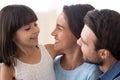 Close up smiling diverse family with small daughter