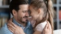 Close up smiling father and little daughter enjoying tender moment Royalty Free Stock Photo