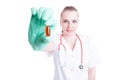 Close-up of smiling female doctor hand holding a pill Royalty Free Stock Photo