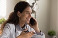 Close up smiling female doctor talking on phone, consulting patient Royalty Free Stock Photo