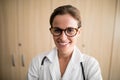 Close-up of smiling female doctor wearing eyeglasses Royalty Free Stock Photo