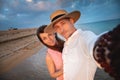 Close-up of smiling happy young couple, two family man and woman hugging each other, taking first person selfie at Royalty Free Stock Photo