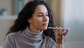 Close-up smiling happy young woman talk on speakerphone record audio message using telephone hispanic girl use virtual Royalty Free Stock Photo