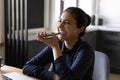 Close up smiling Indian woman holding smartphone, recording voice message Royalty Free Stock Photo