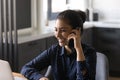 Close up smiling Indian woman talking on phone, laughing Royalty Free Stock Photo