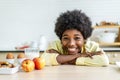 Close up smiling little boy drink glass of milk, sitting at wooden table in kitchen, adorable child kid enjoying organic food Royalty Free Stock Photo