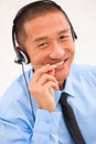 Close-up of smiling male customer service representative wearing Royalty Free Stock Photo