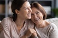 Close up smiling mature mother and grownup daughter cuddling Royalty Free Stock Photo