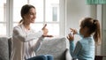 Close up mother and little deaf daughter speaking sign language Royalty Free Stock Photo