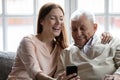 Close up smiling older man with grownup daughter making selfie Royalty Free Stock Photo