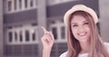 Close up Smiling Pretty Young Woman Pointing Up Royalty Free Stock Photo