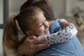 Close up smiling 8s daughter hugging loving Caucasian father Royalty Free Stock Photo