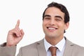 Close up of smiling salesman pointing up Royalty Free Stock Photo
