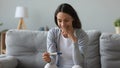 Close up smiling woman holding electronic pregnancy test, good result Royalty Free Stock Photo