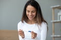 Close up smiling woman holding pregnancy test, excited by result Royalty Free Stock Photo