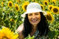 Close up of smiling woman in sunflowers field Royalty Free Stock Photo