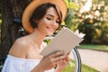 Close up of smiling young girl reading a book Royalty Free Stock Photo