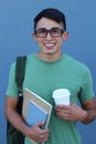 Close-up of smiling young male student on blue background