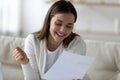 Close up smiling young woman reading letter, good news Royalty Free Stock Photo